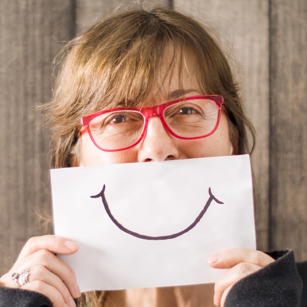 mature-mid-age-woman-with-a-smile-painted-on-paper-picture-id883346956 Happy Sales people
